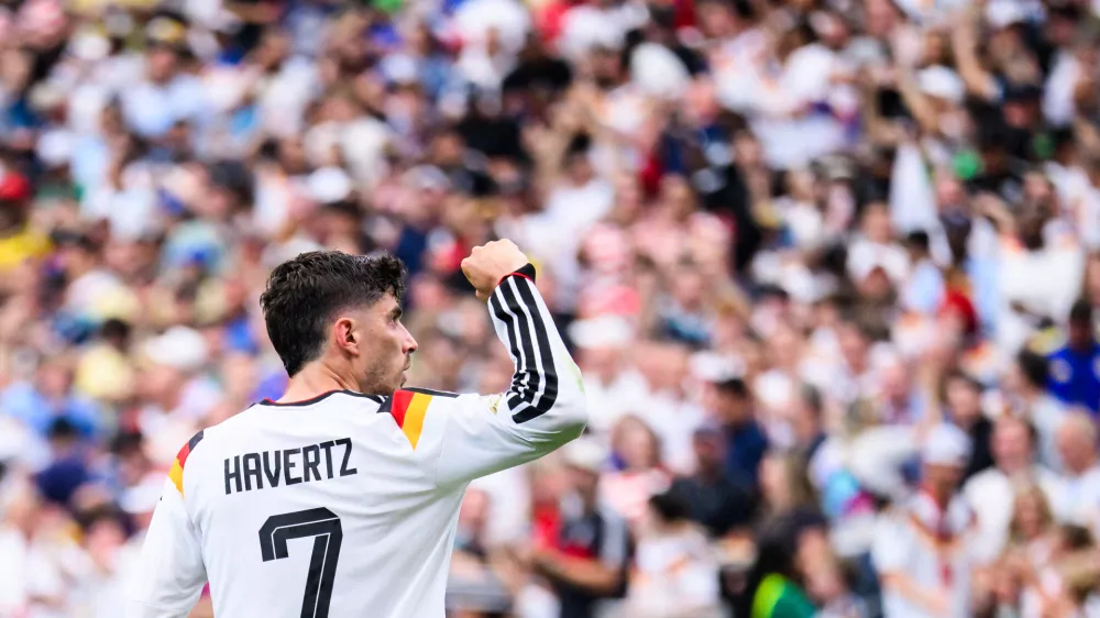 14 June 2026, United States, Houston: Soccer, Men: World Cup, Germany vs. Cura&ccedil;ao, Group Stage, Group E, Matchday 1, Houston Stadium, Kai Havertz (Germany) celebrates after scoring the goal that made it 3-1. ATTENTION: In accordance with FIFA regulations, these images may be used exclusively for editorial purposes. Commercial use is prohibited. Furthermore, no video-like sequences may be created, and no alterations may be made to the image, either in the foreground or the background. Photo: Tom Weller/dpa,Image: 1110384982, License: Rights-managed, Restrictions: GERMANY OUT, Model Release: no 