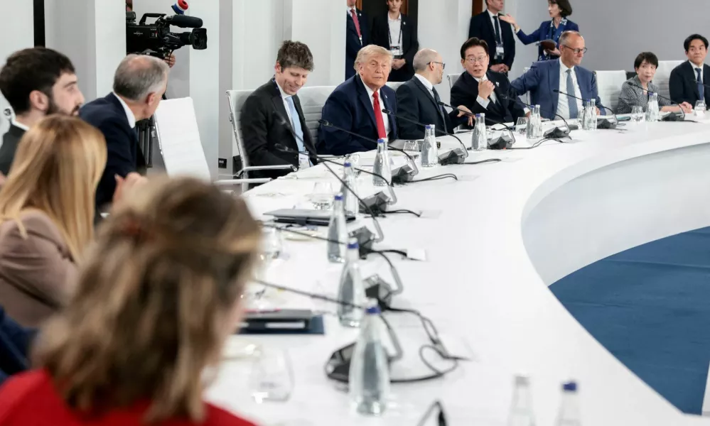 U.S. President Donald Trump, OpenAI CEO Sam Altman, Google DeepMind CEO Demis Hassabis, South Korea's President Lee Jae Myung, Germany's Chancellor Friedrich Merz and Japan's Prime Minister Sanae Takaichi attend a working lunch with G7 leaders, G7 outreach partners and global tech CEOs on innovation and AI during the G7 Summit in Evian-les-Bains, France, June 17, 2026.REUTERS/Evelyn Hockstein REFILE - ADDING INFORMATION