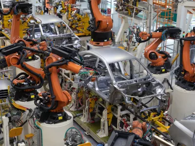 Modern technology of Assembly of cars. The plant of the automotive industry. Shop for the production and Assembly of machines top view. The process of welding parts of the car