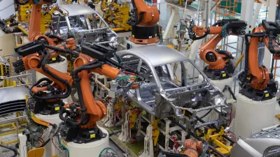 Modern technology of Assembly of cars. The plant of the automotive industry. Shop for the production and Assembly of machines top view. The process of welding parts of the car