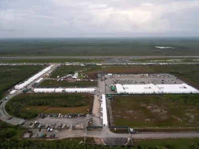 FILE - Work progresses on a new migrant detention facility dubbed "Alligator Alcatraz," at Dade-Collier Training and Transition facility in the Florida Everglades, on July 4, 2025, in Ochopee, Fla. (AP Photo/Rebecca Blackwell, File)