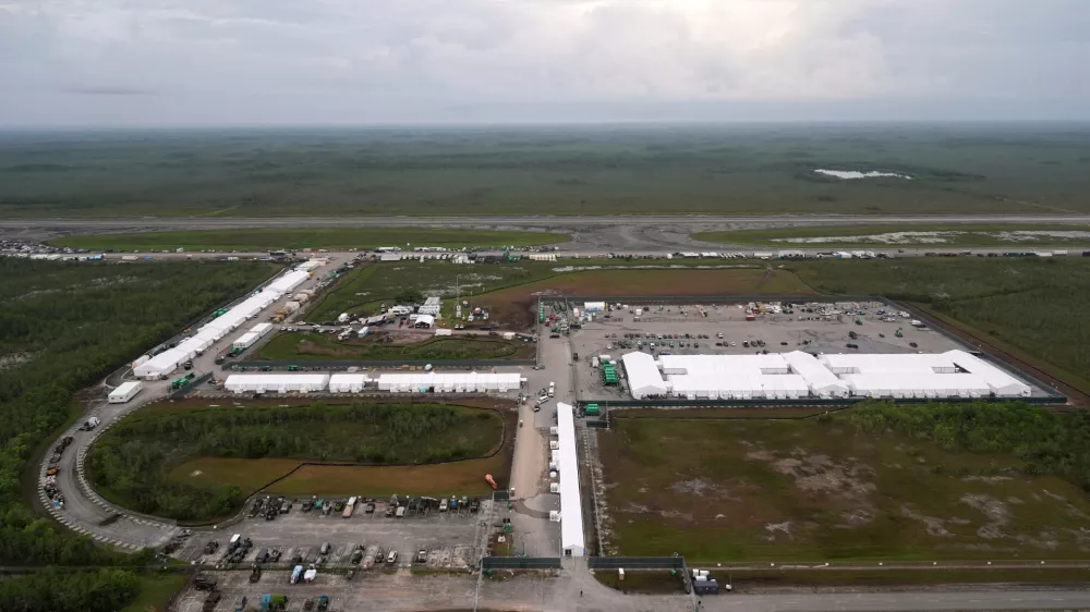 FILE - Work progresses on a new migrant detention facility dubbed "Alligator Alcatraz," at Dade-Collier Training and Transition facility in the Florida Everglades, on July 4, 2025, in Ochopee, Fla. (AP Photo/Rebecca Blackwell, File)