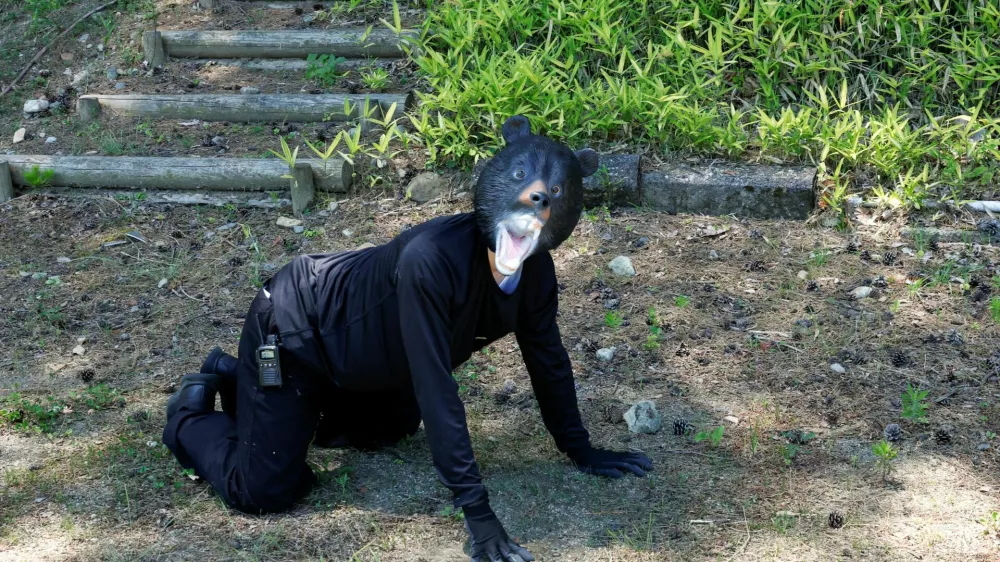 A man wearing a bear costume takes part in an emergency response drill simulating a bear intrusion in Yaita, Tochigi Prefecture, Japan, June 17, 2026. REUTERS/Kim Kyung-Hoon