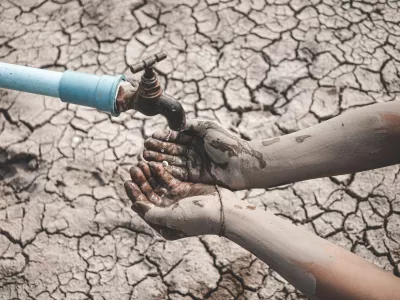 The little boy waiting for drinking water to live through this drought, Concept drought and crisis environment.