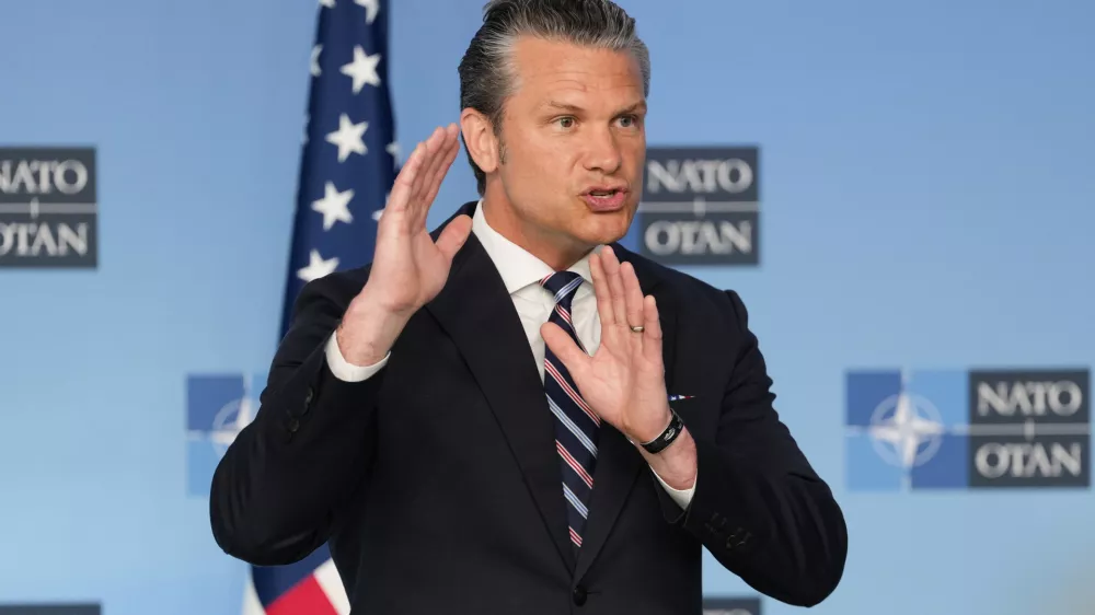 United States Defense Secretary Pete Hegseth speaks during a press statement on arrival for a meeting of NATO defense ministers at NATO headquarters in Brussels, Thursday, June 18, 2026. (AP Photo/Virginia Mayo)