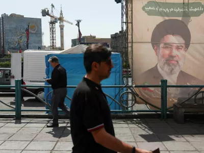 People walk past a banner with a picture of Iran's Supreme Leader, Mojtaba Khamenei, in Tehran, Iran, June 17, 2026. Majid Asgaripour/WANA (West Asia News Agency) via REUTERS ATTENTION EDITORS - THIS PICTURE WAS PROVIDED BY A THIRD PARTY.   ATTENTION EDITORS - THIS PICTURE WAS PROVIDED BY A THIRD PARTY. ISRAEL OUT. NO COMMERCIAL OR EDITORIAL SALES IN ISRAEL. NO ACCESS FOR ISRAELI MEDIA. NO USE BBC PERSIAN. NO USE VOA PERSIAN. NO USE MANOTO. NO USE IRAN INTERNATIONAL. NO USE RADIO FARDA. DIGITAL: NO USE BBC PERSIAN. NO USE VOA PERSIAN. NO USE MANOTO. NO USE IRAN INTERNATIONAL. NO USE RADIO FARDA.