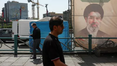 People walk past a banner with a picture of Iran's Supreme Leader, Mojtaba Khamenei, in Tehran, Iran, June 17, 2026. Majid Asgaripour/WANA (West Asia News Agency) via REUTERS ATTENTION EDITORS - THIS PICTURE WAS PROVIDED BY A THIRD PARTY.   ATTENTION EDITORS - THIS PICTURE WAS PROVIDED BY A THIRD PARTY. ISRAEL OUT. NO COMMERCIAL OR EDITORIAL SALES IN ISRAEL. NO ACCESS FOR ISRAELI MEDIA. NO USE BBC PERSIAN. NO USE VOA PERSIAN. NO USE MANOTO. NO USE IRAN INTERNATIONAL. NO USE RADIO FARDA. DIGITAL: NO USE BBC PERSIAN. NO USE VOA PERSIAN. NO USE MANOTO. NO USE IRAN INTERNATIONAL. NO USE RADIO FARDA.