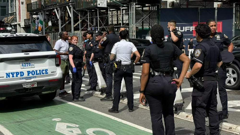 New York Police Department officers gather after alleged gunfire was heard in Times Square, in New York City, U.S., June 18, 2026. Picture taken with a phone. REUTERS/Andrew Hofstetter