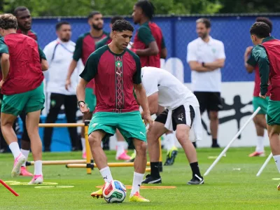 Morocco's Achraf Hakimi exercises during a training session ahead of the World Cup Group C soccer match between Scotland and Morocco in Foxborough, Mass., near Boston, Thursday, June 18, 2026. (AP Photo/Martin Meissner)