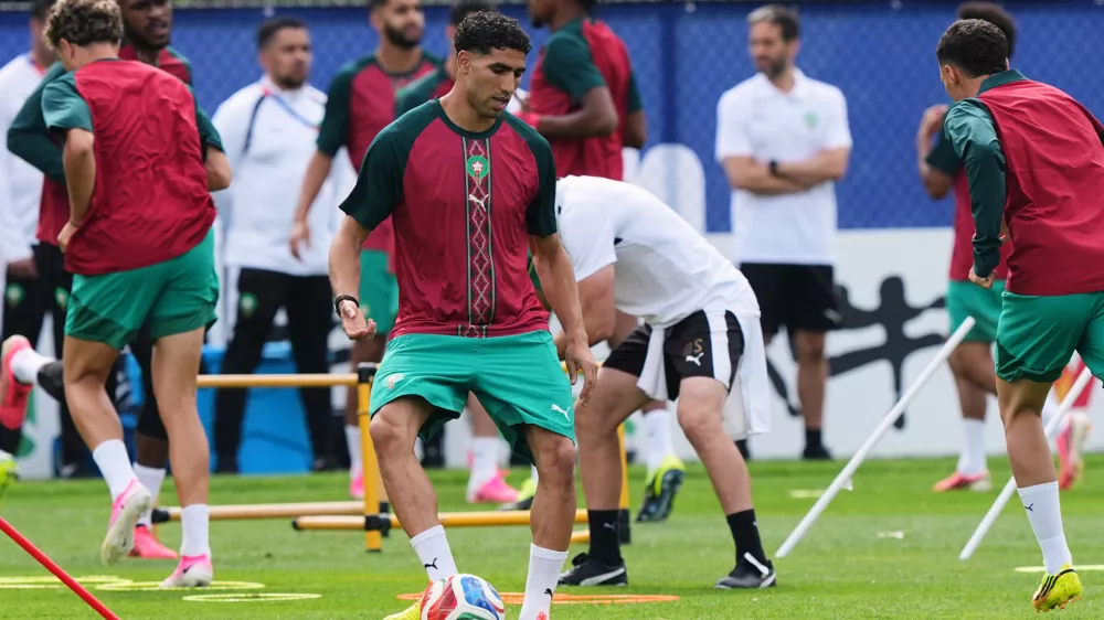 Morocco's Achraf Hakimi exercises during a training session ahead of the World Cup Group C soccer match between Scotland and Morocco in Foxborough, Mass., near Boston, Thursday, June 18, 2026. (AP Photo/Martin Meissner)