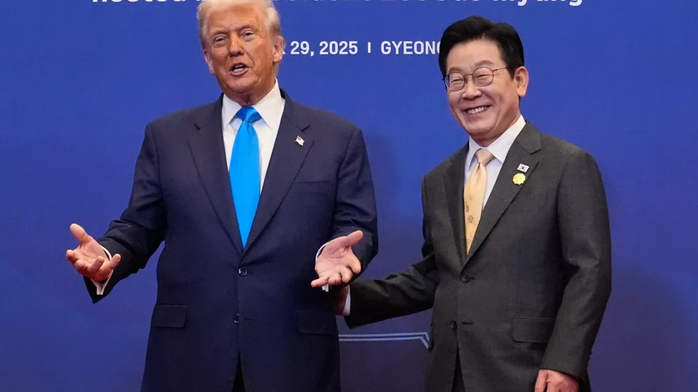 President Donald Trump poses for a photo with South Korean President Lee Jae Myung during a dinner event in Gyeongju, South Korea, Wednesday, Oct. 29, 2025. (AP Photo/Mark Schiefelbein)