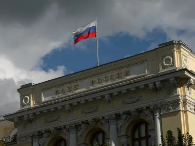 FILE PHOTO: A flag flies above the headquarters of the Russian Central Bank on the day of a meeting, held to set its benchmark interest rate, in Moscow, Russia, September 12, 2025. REUTERS/Ramil Sitdikov/File Photo