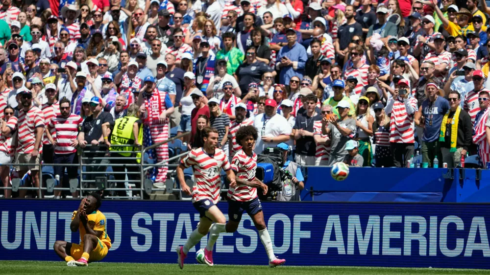 Australia's Nestory Irankunda fans to the ground after being fouled during the World Cup Group D soccer match between the United States and Australia in Seattle, Friday, June 19, 2026. (AP Photo/Lindsey Wasson)