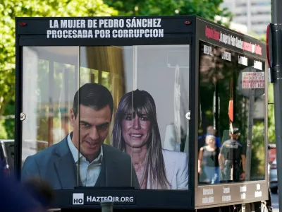 FILE PHOTO: A truck displaying images of Spanish Prime Minister Pedro Sanchez and his wife Begona Gomez drives outside the court as a way of protest on the day Gomez appears in court to testify as part of influence-peddling investigation, in Madrid, Spain, June 15, 2026. REUTERS/Ana Beltran/File Photo