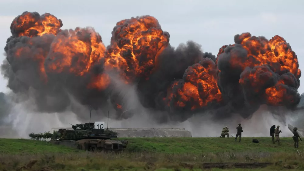 Smoke billows from a blast near Polish Abrams tank as Polish forces with NATO soldiers hold military exercises 'Iron Defender' at a military range in Wierzbiny near Orzysz, Poland, September17, 2025. REUTERS/Kacper Pempel