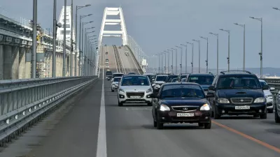 FILE - Cars and other vehicles drive on the Kerch Bridge connecting the Russian mainland and the Crimean Peninsula on Thursday, Feb. 23, 2023.  (AP Photo, File)