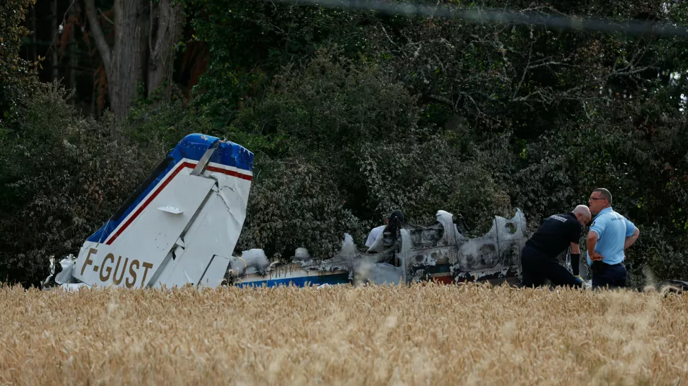 Forensic technicians examine the wreckage of the Cessna 421 piloted by Ubisoft co-founder Claude Guillemot, who was killed when the aircraft crashed while approaching La Baule-Escoublac airfield Friday evening in La Baule, western France, Saturday, June 20, 2026. (AP Photo/Jeremia Gonzalez)