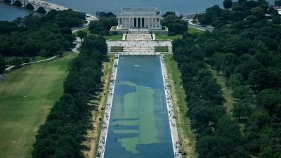 In an aerial view from the Washington Monument, crews remove algae from the bottom of the Lincoln Memorial Reflecting Pool after recent renovations following a directive from U.S. President Donald Trump to paint it blue ahead of the 250th anniversary of U.S. independence, in Washington, D.C., U.S., June 19, 2026. REUTERS/Aaron Schwartz