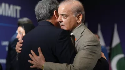 Iran's Foreign Minister Abbas Araqchi, left, and Pakistan's Prime Minister Shehbaz Sharif greet each other before the start of a quadrilateral meeting between the U.S., Iran, Pakistan, and Qatar, at the Bürgenstock Resort in Obbuergen, Switzerland, Sunday, June 21, 2026. (Nathan Howard/Pool Photo via AP)