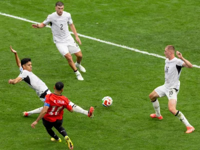 Egypt's Mohamed Salah (10) strikes the ball between New Zealand's defenders during the second half of a World Cup Group G soccer match, in Vancouver, British Columbia, Sunday, June 21, 2026. (Timothy Matwey/The Canadian Press via AP)