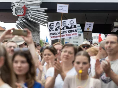 People display a sign reading "Normalization is not normal, let's defend Czech television" during a protest rally in support of public media as the Czech government plans to revamp and cut funding for Czech TV and Czech Radio, in Prague, Czech Republic, June 21, 2026 REUTERS/Eva Korinkova