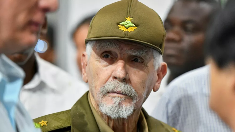 FILE PHOTO: Commander of the Revolution and Cuba's former Vice President Ramiro Valdes looks at Cuba's President Miguel Diaz-Canel during a visit to the 3rd International Exhibition of Renewable Energy and Energy Efficiency, in Havana, Cuba September 20, 2024. REUTERS/Norlys Perez/File Photo