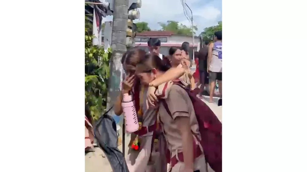 In this photo taken from a video, students react after a shooting incident at the San Jose National High School in Tacloban city, Philippines Monday, June 22, 2026. (James Daantos via AP Photo)