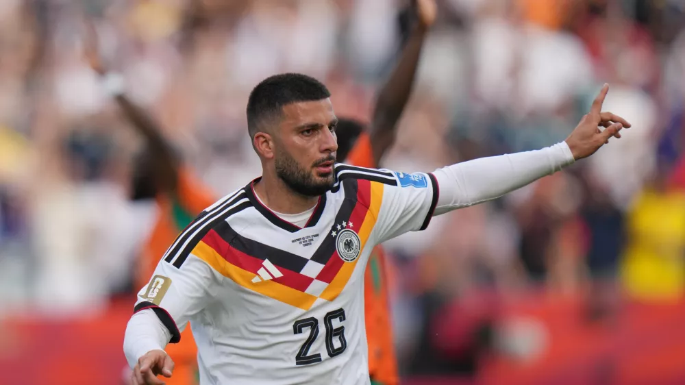 Germany's Deniz Undav celebrates after scoring their second goal during the World Cup Group E soccer match between Germany and Ivory Coast in Toronto, Saturday, June 20, 2026. (AP Photo/Stephanie Scarbrough)