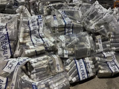 In this undated photo provided by the Australian Federal Police, a quantity of cocaine is bagged and displayed in Sydney. (Australian Federal Police via AP)