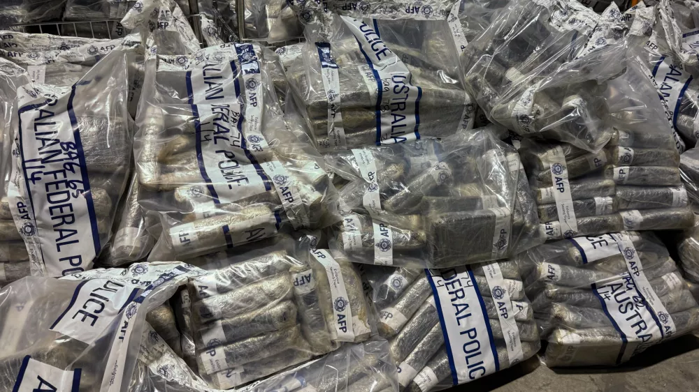 In this undated photo provided by the Australian Federal Police, a quantity of cocaine is bagged and displayed in Sydney. (Australian Federal Police via AP)
