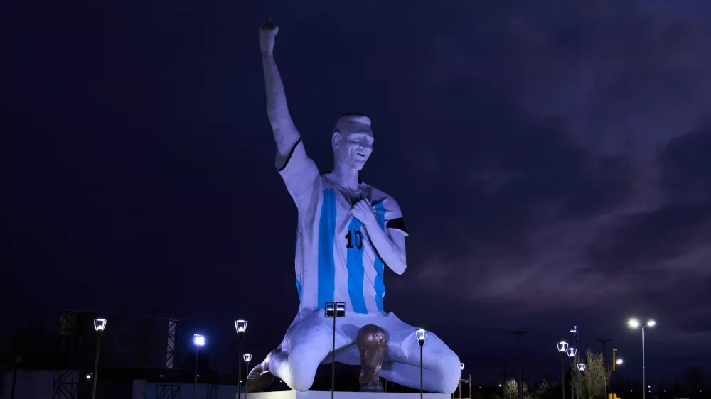 A sculpture of soccer star Lionel Messi by artist Aldo Beroisa, that was unveiled for Argentina's opening World Cup match against Algeria, stands in Cutral Co, Argentina, at sunrise Sunday, June 21, 2026. (AP Photo/Nestor Ponce)