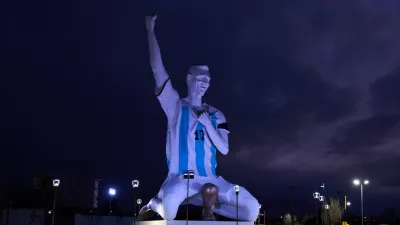 A sculpture of soccer star Lionel Messi by artist Aldo Beroisa, that was unveiled for Argentina's opening World Cup match against Algeria, stands in Cutral Co, Argentina, at sunrise Sunday, June 21, 2026. (AP Photo/Nestor Ponce)