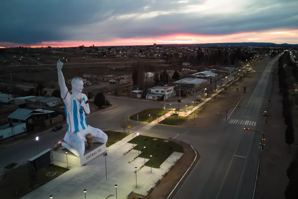 A sculpture of soccer star Lionel Messi by artist Aldo Beroisa, that was unveiled for Argentina's opening World Cup match against Algeria, stands in Cutral Co, Argentina, at sunrise Sunday, June 21, 2026. (AP Photo/Nestor Ponce)