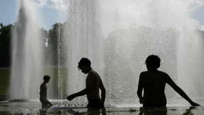 Children cool off in the Trocadero Fountain next to the Eiffel Tower in Paris as temperatures rise during a heatwave affecting a large part of France, June 22, 2026. REUTERS/Abdul Saboor