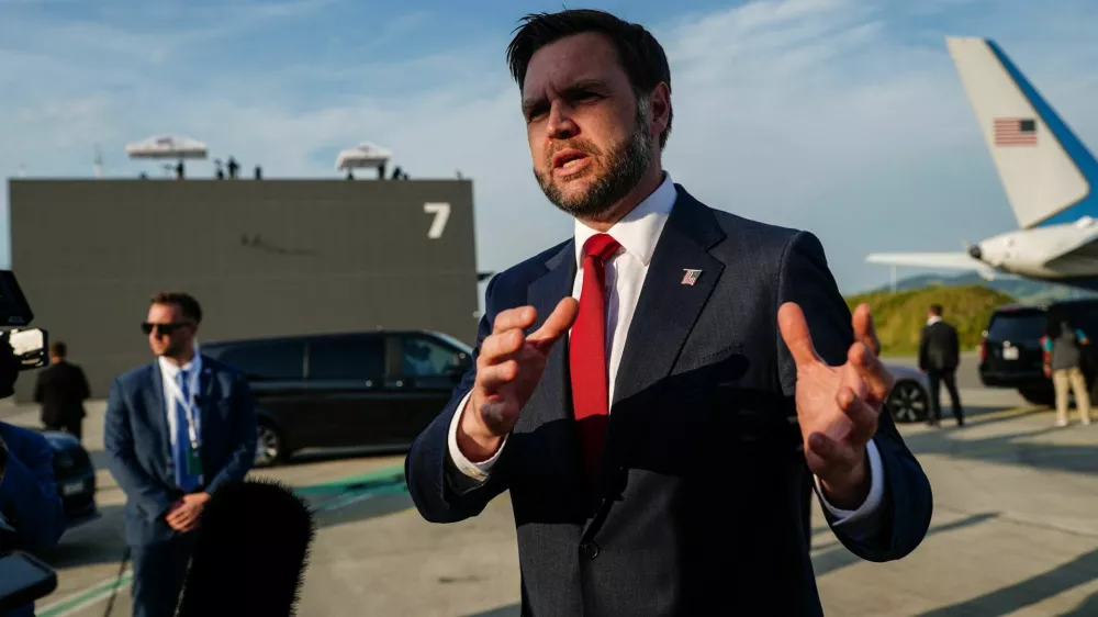 U.S. Vice President JD Vance speaks to members of the media before boarding Air Force Two, after the U.S. and Iran held high-level talks at the Lake Lucerne Summit, at Emmen Military Air Base, Emmen, Switzerland, June 22, 2026. REUTERS/Nathan Howard/Pool