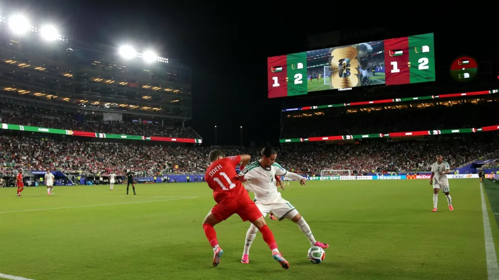 Soccer Football - FIFA World Cup 2026 - Group J - Jordan v Algeria - San Francisco Bay Area Stadium, Santa Clara, California, U.S. - June 22, 2026 Algeria's Anis Hadj Moussa in action with Jordan's Odeh Fakhoury IMAGN IMAGES via Reuters/David Gonzales
