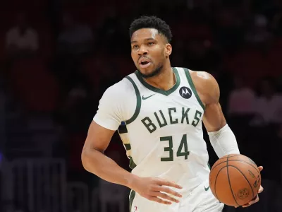 FILE - Milwaukee Bucks forward Giannis Antetokounmpo (34) dribbles the ball during the first half of an NBA basketball game against the Miami Heat, March 12, 2026, in Miami. (AP Photo/Marta Lavandier, File)