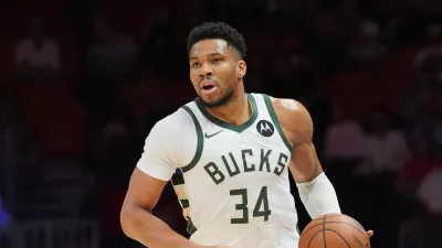 FILE - Milwaukee Bucks forward Giannis Antetokounmpo (34) dribbles the ball during the first half of an NBA basketball game against the Miami Heat, March 12, 2026, in Miami. (AP Photo/Marta Lavandier, File)