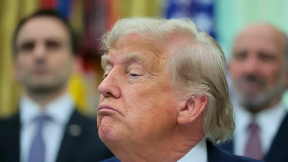 U.S. President Donald Trump looks on as he speaks to reporters before signing two executive orders regarding quantum computing, in the Oval Office at the White House in Washington, D.C., U.S., June 22, 2026. REUTERS/Jonathan Ernst