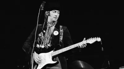COPENHAGEN, DENMARK - JUNE 20: Eric Clapton performs on stage at the KB Hallen on June 20th 1974 in Copenhagen, Denmark. He plays his Fender Stratocaster guitar 'Blackie'. (Photo by Jorgen Angel/Redferns)