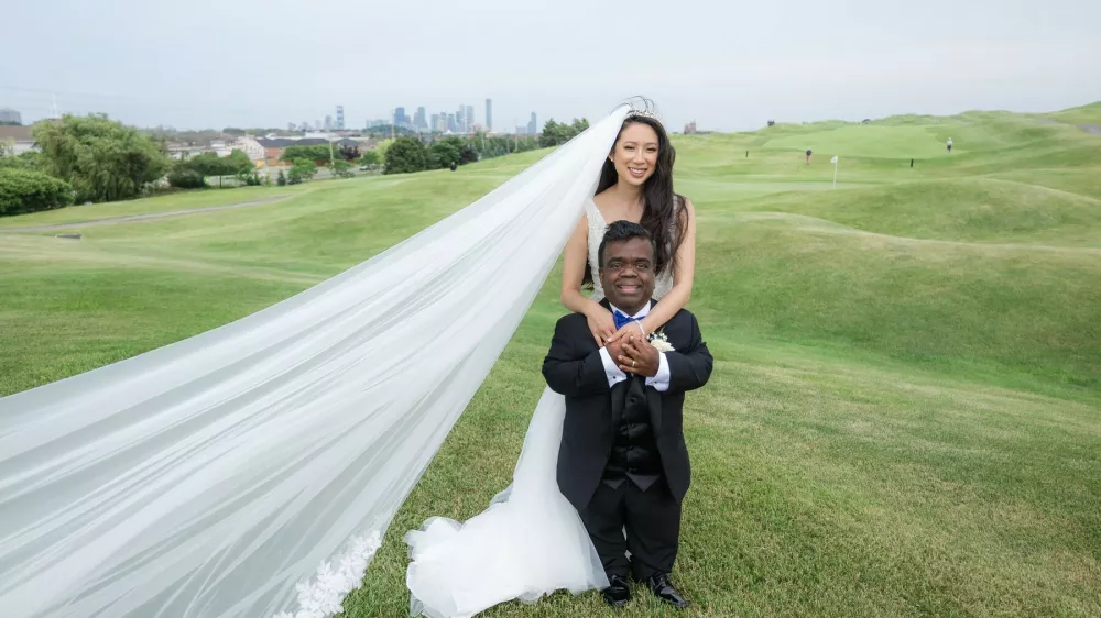 Story from Jam Press (Dwarfism Dating Advice)Pictured: Timothy Muttoo and Anita Wing Lee getting married.'I am a 4ft man with dwarfism - here is how I bagged my taller dream wife who overlooks my height'A 4ft man with dwarfism has lifted the lid on the little things he did to bag his 5ft 4in sweetheart wife after their wedding went viral.Timothy Muttoo and Anita Wing Lee's marriage had the internet hooked, with the pair both prioritising heart over height.Now the engineer is handing out dating advice to other men who may be struggling with confidence over their height.The happy husband has claimed that the friendzone is the best place to start when courting a potential lover."I just wanted to build a friendship with Anita," Timothy, from Toronto, Canada, told&nbsp;creatorzine.com&nbsp;."It wasn't like oh I'm going to ask her out on a date and if she says yes I'm going to ask her on another date and then by the third date we're going to be boyfriend and girlfriend."Those weren't even crossing my mind."When I put it in that context it made me feel relaxed."After six months of being married the pair posted a clip online of the "adorable moments" they have day to day due to their height differences.The clip showcasing them being able to go in the fridge at the same time, look out the window together and check the bottom and top cupboards went viral.The video racked up a whopping 1.7m views and over 24,600 likes.The added attention online encouraged the couple to speak out about their relationship in more detail with Timothy offering advice to other men who were previously in his position.Timothy said: "Height was never something either of us intentionally prioritized in relationships."What feels different about this relationship is the connection and alignment in values."We share faith, purpose and long-term vision. That foundation matters far more than physical traits."The pair first met in 2021 and after a long friendship they became lovers before getting married in June 2025.Anita posted their marriage online to her 47,700 followers - with the post blowing up and the viewers giving a mixed response.Timothy said: "Our wedding post unexpectedly went viral and reached millions of people around the world."Most comments were about love, joy and hope."Of course, the internet can bring criticism, but we do not let that define our experience."We focus on the thousands of kind messages from people who say our relationship gives them courage to choose love beyond surface-level expectations."ENDSEDITOR'S NOTE:&nbsp;Video Usage Licence:(EXCLUSIVE) We have obtained an exclusive licence from the copyright holder. A copy of the licence is available on request.Video Restrictions: None.,Image: 1090626503, License: Rights-managed, Restrictions: EDITOR'S NOTE:&nbsp;Video Usage Licence:(EXCLUSIVE) We have obtained an exclusive licence from the copyright holder. A copy of the licence is available on request.Video Restrictions: None., Model Release: no 