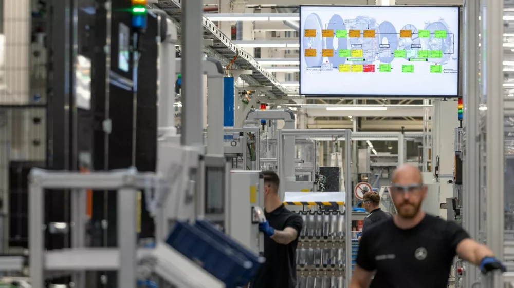 FILE PHOTO: Worker assemble axial-flux motors for electric vehicles on an assembly line at the Mercedes-Benz engine factory in Berlin, Germany June 9, 2026. REUTERS/Axel Schmidt/File Photo