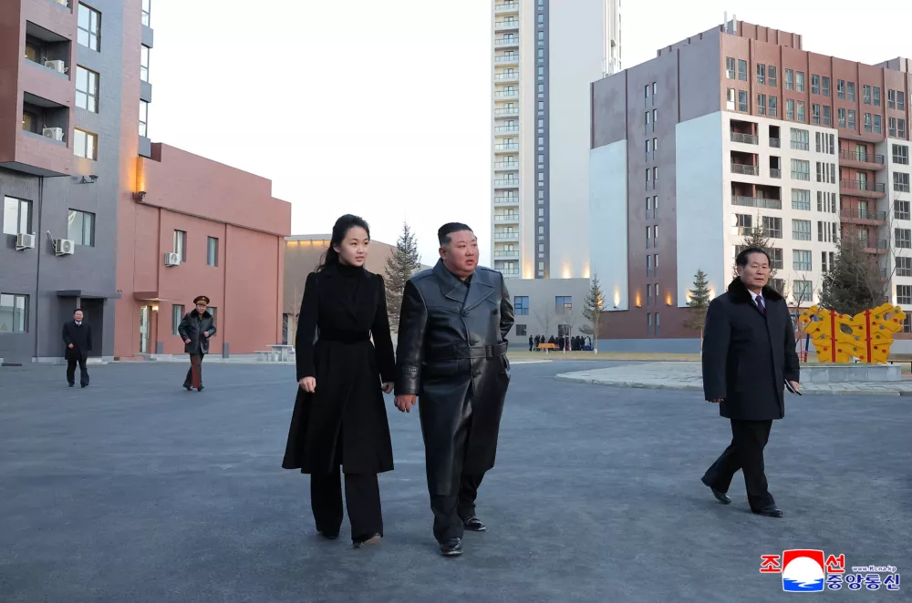 North Korean leader Kim Jong Un and his daughter Kim Ju Ae attend the completion ceremony of a new housing district in Pyongyang for families of troops who died in overseas military operations, state media KCNA said, in this picture released by North Korea's official Korean Central News Agency, February 16, 2026. KCNA via REUTERS  ATTENTION EDITORS - THIS IMAGE WAS PROVIDED BY A THIRD PARTY. REUTERS IS UNABLE TO INDEPENDENTLY VERIFY THIS IMAGE. NO THIRD PARTY SALES. SOUTH KOREA OUT. NO COMMERCIAL OR EDITORIAL SALES IN SOUTH KOREA.