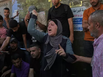 Mourners react during the funeral of Palestinian Raghad Hassan Ashour, 16, after she was killed in an Israeli airstrike, at Al-Shifa Hospital, Gaza City, Monday, June 22, 2026. (AP Photo/Jehad Alshrafi)