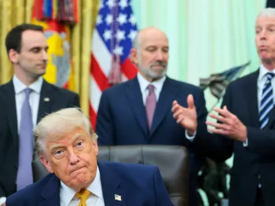 U.S. President Donald Trump, with White House Office of Science and Technology Policy Director Michael Kratsios, Secretary of Commerce Howard Lutnick and Secretary of Energy Chris Wright, attend a signing of two executive orders regarding quantum computing, in the Oval Office at the White House in Washington, D.C., U.S., June 22, 2026. REUTERS/Jonathan Ernst
