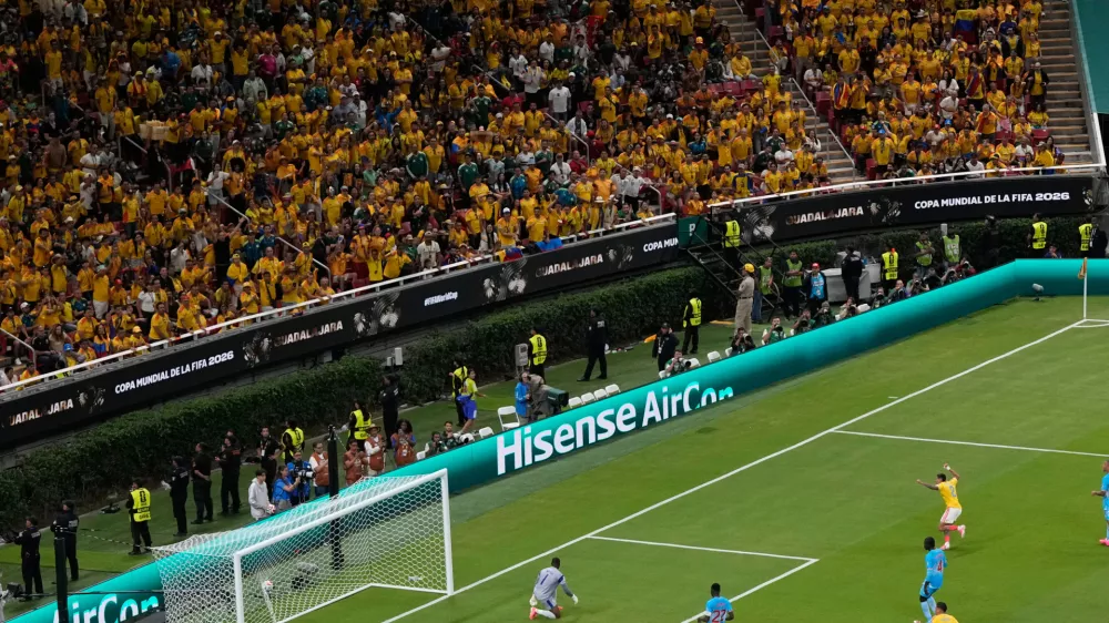 Colombia's Daniel Munoz (2) celebrates after scoring his side's opening goal during the World Cup Group K soccer match between Colombia and Congo in Zapopan, near Guadalajara, Mexico, Tuesday, June 23, 2026. (AP Photo/Silvia Izquierdo)