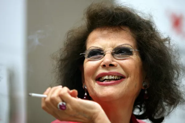 FILE PHOTO: Italian actress Claudia Cardinale smiles during a news conference in Cluj Napoca June 7, 2009. Cardinale received a lifetime award at the end of the eighth edition of the Transylvania International Film Festival (TIFF). REUTERS/Mircea Rosca (ROMANIA ENTERTAINMENT HEADSHOT)/File Photo