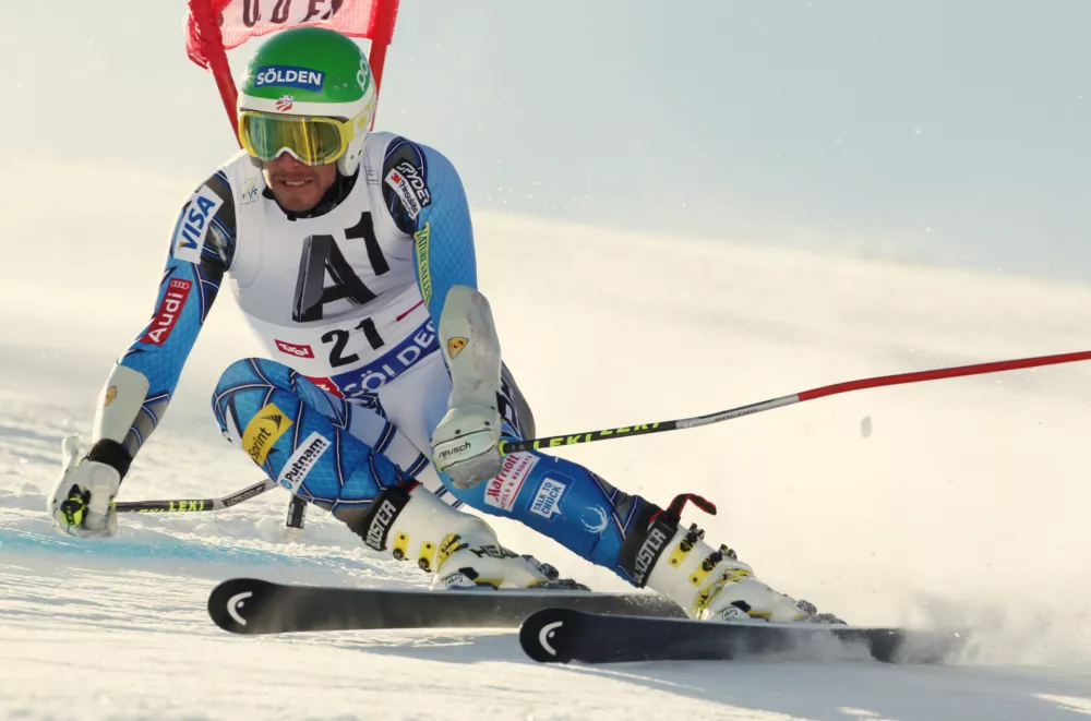 United States' Bode Miller speeds down the course during an alpine ski, men's giant slalom in Soelden, Austria, Sunday, Oct. 23, 2011. (AP Photo/Alessandro Trovati)