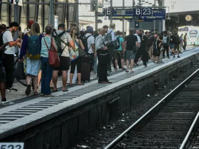 Passengers wait for a train at a platform in the central train station in Frankfurt, Germany, Wednesday, June 24, 2026, following the nationwide service disruption on the Deutsche Bahn network. (AP Photo/Michael Probst)