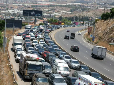 Cars queue, as displaced people make their way back to their homes in southern Lebanon following an interim deal between the U.S. and Iran, in Sidon, Lebanon, June 23, 2026. REUTERS/Aziz Taher